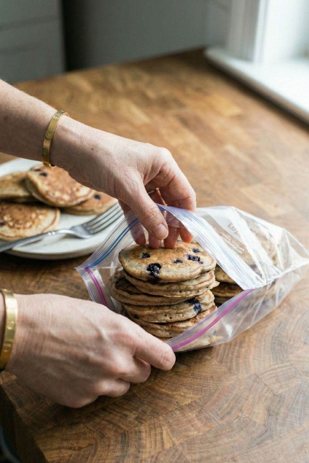 Cold protein pancakes packed in a clear ziplock bag. A soft, mess-free healthy breakfast idea for early morning flights.