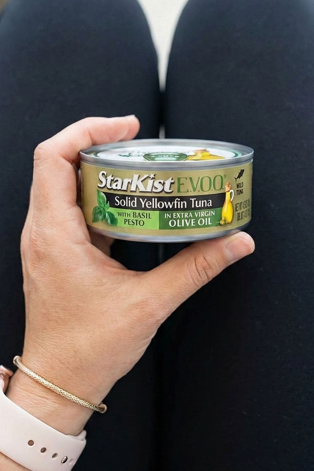 Close-up of a StarKist E.V.O.O. Yellowfin Tuna pouch held in lap. A high-protein, low-calorie travel snack that fits in a carry-on bag.